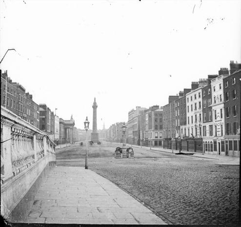 Sackville Street from Carlisle Bridge. 1860-1864. Now O'Connell Street from O'Connell Bridge. The National Library of Ireland. No known copyright restrictions.