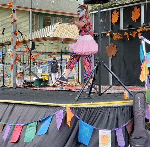 Clown Car Drag performer doing solo performance on stage.