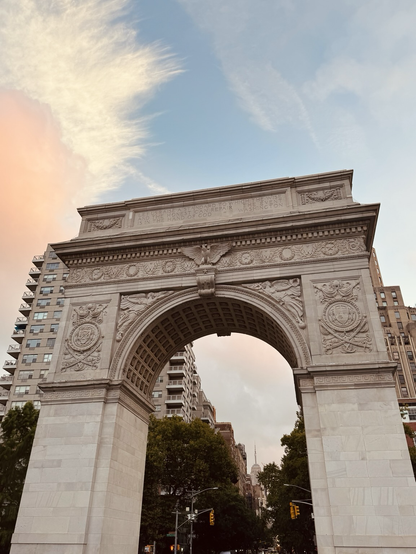 Red white and blue sunrise skies over Washington Square Park Arch