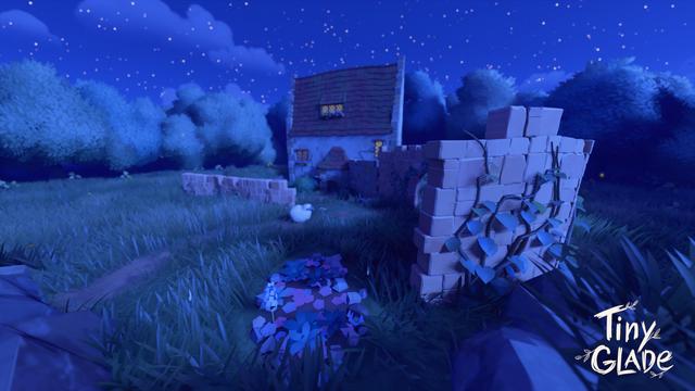 A nighttime scene from "Tiny Glade" with the same stone house and brick wall from the previous image, but now under a starry sky. The house glows warmly from its windows, and a small white sheep is visible near the wall. The scene is calm and illuminated by soft moonlight.