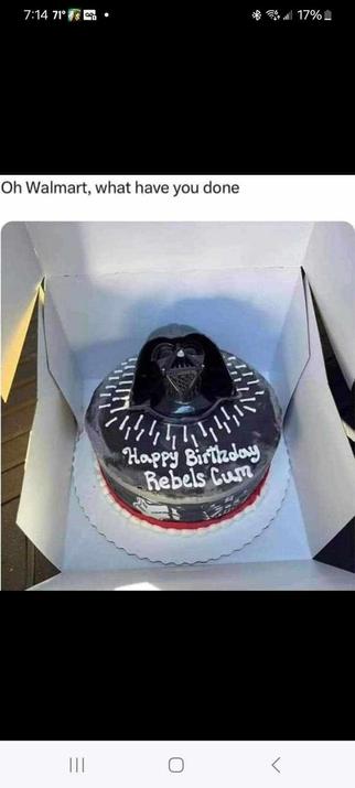 So, this is a nice looking cake, it's all black with Darth Vader's head on the top, in white writing it says:

Happy Birthday Rebels Cum