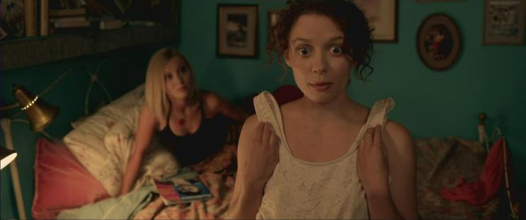 Lara Jean Chorostecki and Katrina Pešić in the 2012 romantic comedy PLEASE KILL MR. KNOW IT ALL