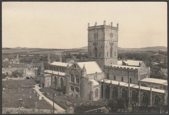 Monochrome real photographic postcard showing a view of St David's Cathedral at St David's in Pembrokeshire seen from the south east.
Published by Mendus, Chemist, St David's, Large View, not numbered, c.1940s.
Postally unused.
Very good condition, with slight corner bumps.