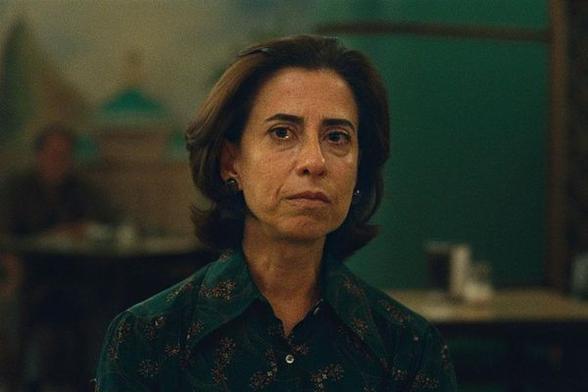 a woman stares resolutely towards the camera in this still from I'm Still Here