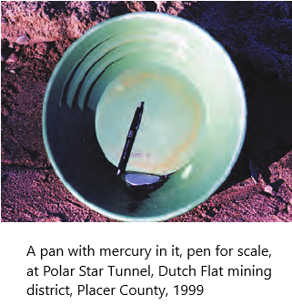 photo - A pan with mercury in it, pen for scale, at Polar Star Tunnel, Dutch Flat mining district, Placer County, 1999