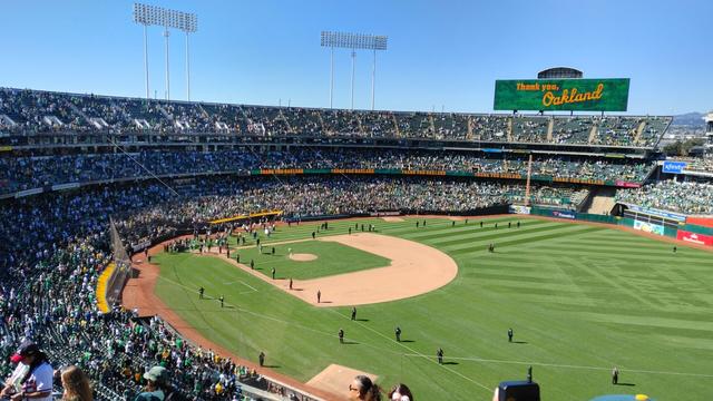 A picture of the Oakland coliseum field after the last pitch of the last game they are playing in Oakland.