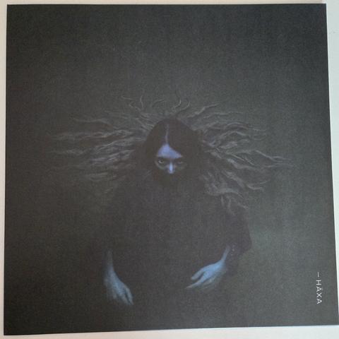 i Häxa's "Part Three" gatefold LP, front cover - a woman wearing a dark robe looking up while submerged into greenish water. From the nose up, her head is above the water, her hair is floating on the surface.