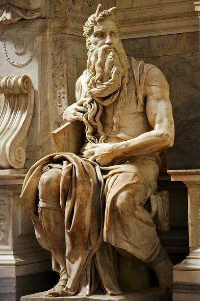 Michelangelo, Moses (ca. 1513–15), for the Tomb of Julius II. Collection of San Pietro in Vincoli, Rome. The Renaissance marble sculpture depicts buff, bearded, seated Moses (with horns on his head likely based on a description in chapter 34 of Exodus in the Vulgate, the Latin translation of the Bible used at that time). It is an extraordinary technical achievement to make flowing hair and lifelike anatomy.