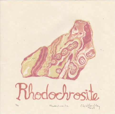 My  linocut print on 8” x 8” cream coloured washi paper shows a specimen of rhodochrosite complete with the word “Rhodochrosite” in script in dusky rose. The mineral is printed in tints and shades of dusky rose and cream with some wiggly stripes and irregular concentric rings of colour with the irregular shape of a rock.