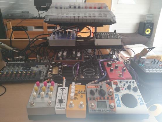 Guitar effects pedals on a rack