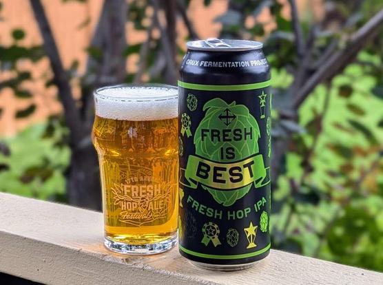 Fresh is Best Fresh Hop IPA from Crux Fermentation Project of Bend, Oregon. It's a fresh hop beer in an attractive black and green can, poured into a half-measure glass with "Fresh Hop Ale Festival" etched on it, because it was the tasting glass from the Fresh Hop Ale Festival I attended in 2019 in Yakima, Washington.