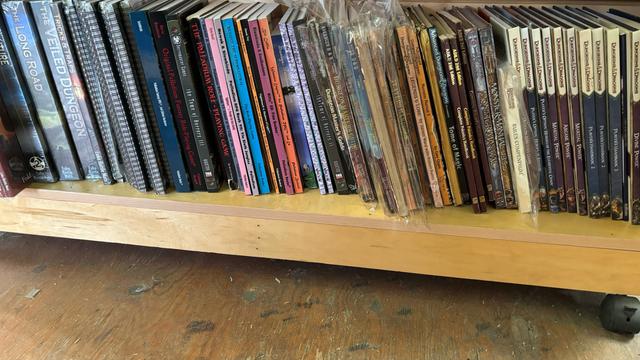 Shelf full of older (A)D&D books.
