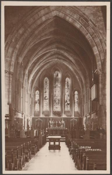 Sepia real photographic postcard showing a view of the interior of Brecon Cathedral in Breconshire.
Published by O. Jackson, Brecon, not numbered, 1933.
Postally unused.
Very good condition, with very slight corner bumps.