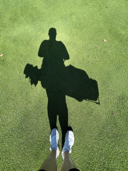 Selfie of my shadow and golf bag on my back.