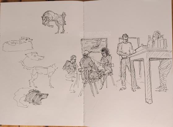 Black Fineliner/ ink on paper. Sketches of a horse, dogs and a scenery where people are sitting together on chairs (a picture behind them) and other people standing by a table besides them.  Bottles and other stuff on the table is indicated.