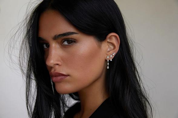 Tamara Kalinić wearing pear earrings.