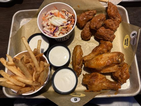 A photo I took of the traditional wings, boneless wings, fries and coleslaw from Buffalo Wild Wings.