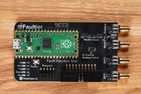 Black Faultier PCB with the Raspberry Pi Pico module soldered on. On the right 4 SMA connectors and pin headers on the bottom of the board.