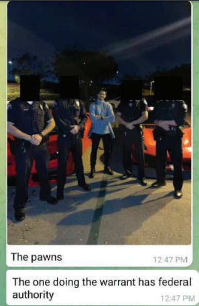 The government's indictment includes a photo allegedly of the accused (Adam Iza) surrounded by high-end sports cars and deputies on his payroll from the Los Angeles Sheriff's Department. Iza is standing in the middle with his arms crossed, flanked by two uniformed deputies. The caption reads: "The pawns. The one doing the warrant has federal authority." This was allegedly a message that Iza sent to a co-conspirator.