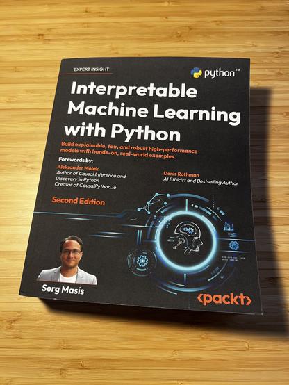 Image of the book Interpretable ML with Python on a table