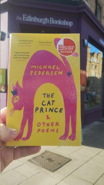 A copy of The Cat Prince and Other Poems by Michael Pedersen, outside the door to the Edinburgh Bookshop