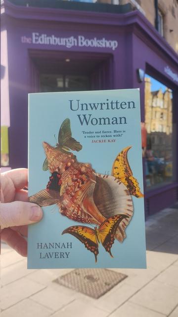 A copy of Unwritten Woman by Hannah Lavery, outside the Edinburgh Bookshop