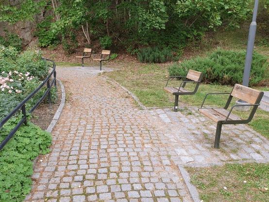 park benches that are split in half to stop ppl from laying down, so it looks like two seats far apart instead