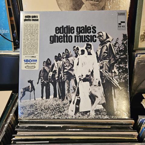 Album cover features a black and white photograph of Eddie Gale and nine other musicians, dressed in robes with hoods over their heads, holding instruments, standing in a grassy outdoor setting.  They have a couple of amazing looking dogs on leashes with them - brindle coated Great Danes by the look of it.