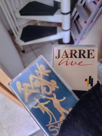 Casettes boxes (audio tapes) from Jean Michel Jarre (Jarre Live, White audio tape box) and Les Rita Mitsouko (blue with orange-bordered yellow 80s/90s and writing effect font) held both at the time by op