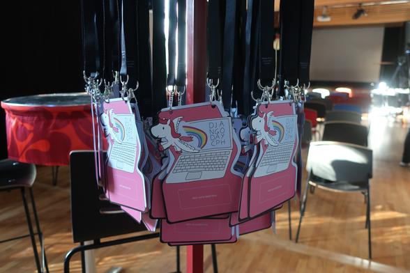 Photo of a lot of blank name badges hanging from their lanyards.