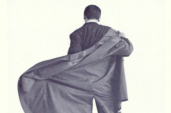1963 Vintage Portrait of a Man Unraveling His Suit Jacket

The image displays an individual standing against a plain background, with their body facing away from the viewer.
They are in the process of taking off or adjusting their suit jacket over their right shoulder.