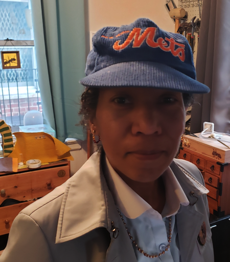 Photo of me this morning smiling with my corduroy METS hat on. Because the Mets are winning!