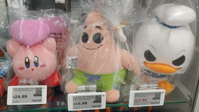 A picture of Kirby holding a heart like in the game Kirby Star Allies. Patrick Star from Spongebob is beside him and so is Donald Duck. They both have dark evil eyes.