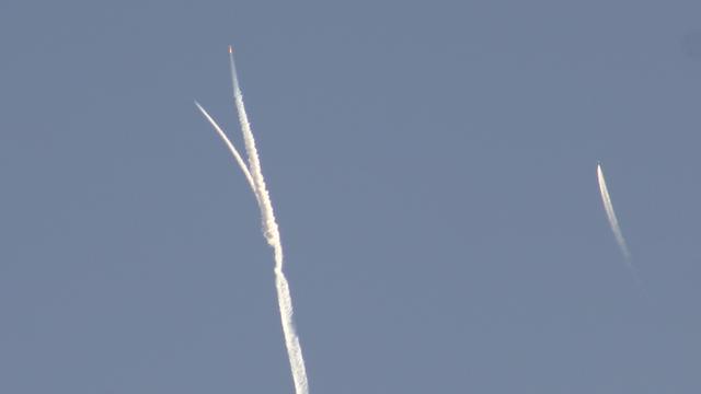SpaceShipOne was air-launched from White Knight at 43,000ft/13000m altitude. The contrails show SpaceShipOne's orange flame under the boost phase of its flight as the White Knight carrier plane banks away from the rocket ignition. The other contrail on the right is the Alpha Jet chase plane recording in-flight video.

October 4, 2004, Mojave, California

photo by Ian Kluft