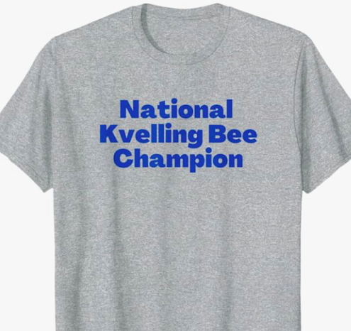 National Kvelling Bee Champion is shown in blue lettering.