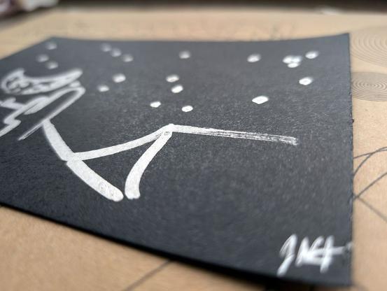 A minimalist desert scene under a moonlit sky, created using a pen plotter programmed to dip a paintbrush into silver metallic ink. The crescent moon floats above abstracted desert dunes and cacti, outlined in smooth lines. Scattered stars are represented with silver ink dabs, creating a serene, expansive night sky. The reflective quality of the silver ink against the black background evokes the calm and solitude of a desert night. In close-up, the textured silver ink stars have a cratered, hand-painted appearance, adding dimension. The crescent moon is detailed with metallic strokes, enhancing the organic feel of the scene. This piece meditates on the quiet of a desert night, its calm reinforced by each star and line being hand-programmed—each element unique, like every night spent under the sky.