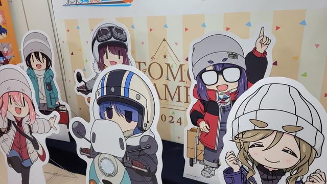 Large cardboard cutouts of the characters from Yuru Camp