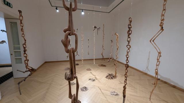 chains carved from wood, hanging from the ceiling