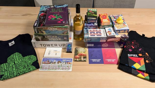 A dozen of board games (4 large boxes, 2 medium ones, and the rest smaller), t-shirts, a couple of books and assorted miscellaneous stuff.