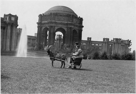 Palace of Fine Arts, 1932. View across the lagoon toward the rotunda, two women posing in commercial goat cart on the lawn (not the professional photo, this is one of the latest goat cart pictures I've seen)