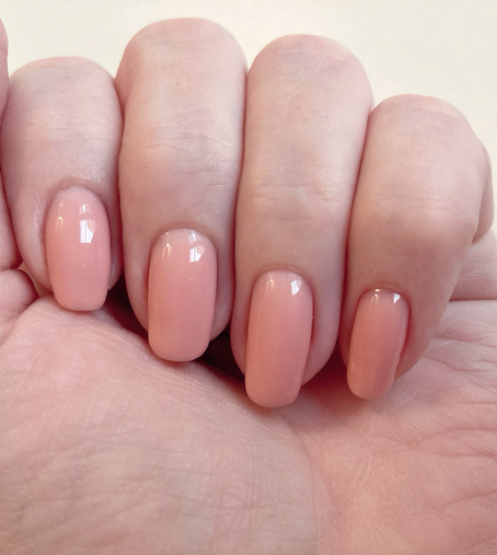 Plain peachy-pink builder gel polish on one hand. The colour does NOT go with my pale white skin tone!