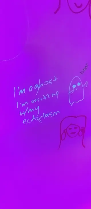 A picture of a drawing of a ghost. There's text beside it saying, "I'm a ghost writing w/ my ectoplasm". The marker it was written with is glow in the dark.