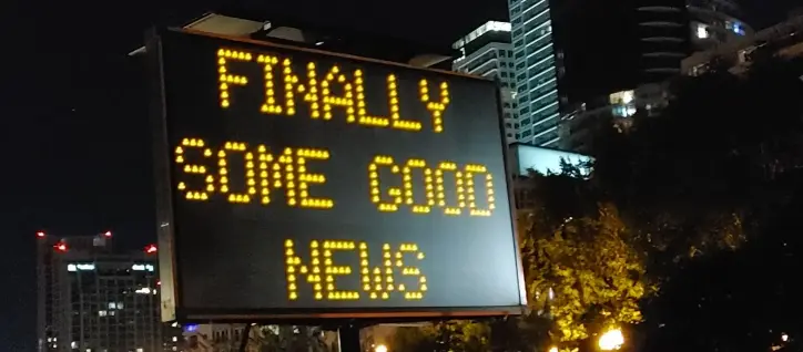 A picture of a digital traffic sign that says, "FINALLY SOME GOOD NEWS"