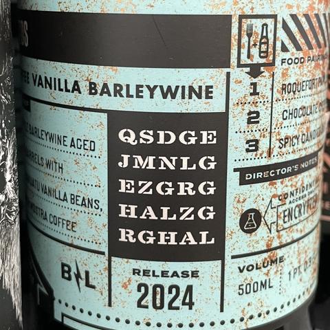 Cryptogram on a barleywine bottle label reading:

QSDGE
JMNLG
EZGRG
HALZG
RGHAL