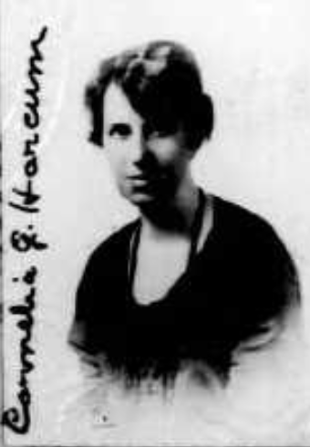 Cornelia Gaskins Harcum, from her 1924 passport application; a white woman with short dark hair, with her signature along the edge of the photo