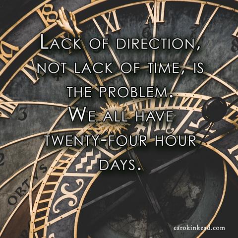 Closeup of a clock face, old and ornate, with zodiac signs and other arcane features, one hand being a small miniature hand. Over this are the words, "Lack of direction, not lack of time, is the problem. We all have twenty-four hour days.”