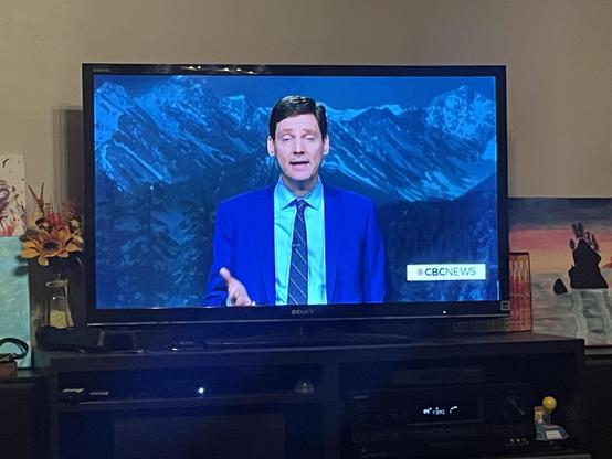 The tall man looks pleading as he gestures