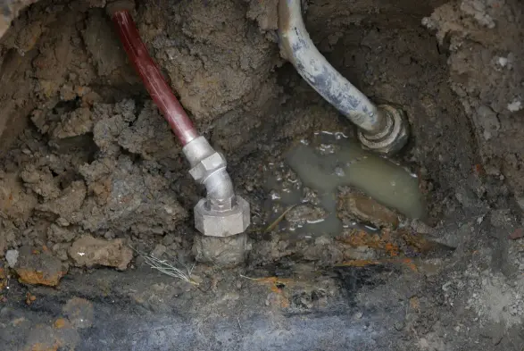 photo of metal water pipes underground