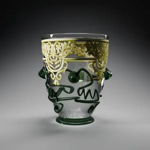 View of the modelled ornate beaker: a transparent glass tumbler with a green foot and four sinuous prunts. A ccentimetreunder the rim, all around the circumference,  is an ornate white and yellow decor of mascarons and simplified leaves.