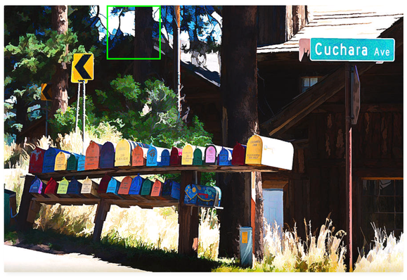 A double row of metal mailboxes, each colorfully painted by the owner, is eye-catching when you see them from the back country highway.  On the right, is the street sign for Cuchara Ave.  Photo Art by Debra Martz  Photo Art by Debra Martz